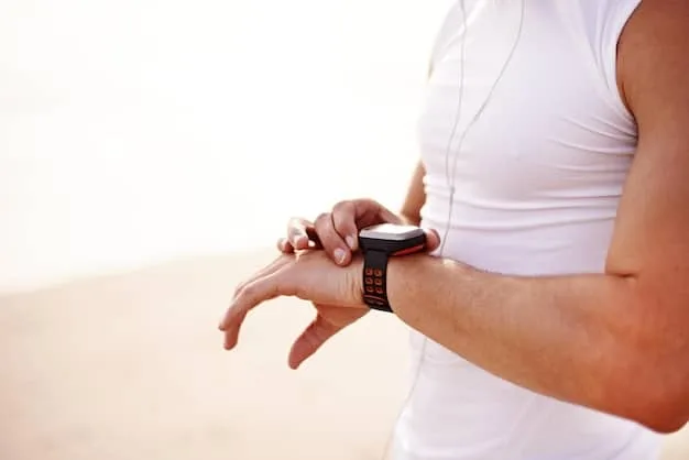 A close-up shot of a man's wrist wearing a sleek, modern smartwatch, displaying health metrics like heart rate or steps, in a minimalist setting.