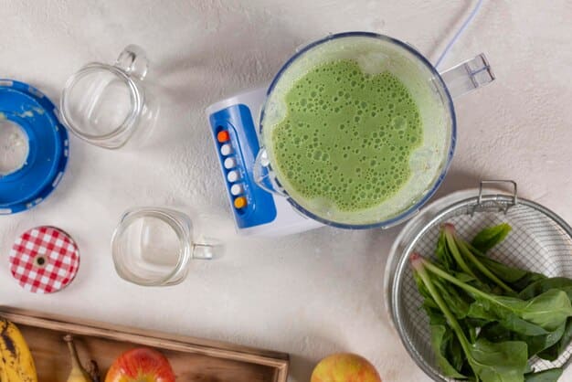 A close-up shot of a high-speed blender in action, with vibrant green smoothie swirling inside. The background shows a modern kitchen with fresh produce, emphasizing healthy eating.