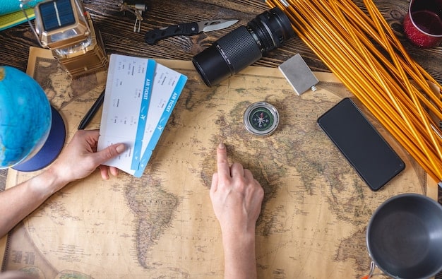 A close-up of various credit cards with travel-related imagery such as airplanes, world maps, and suitcases. The cards are arranged to showcase their designs and emphasize the travel rewards they offer. The lighting is bright and professional, highlighting the details of each card.