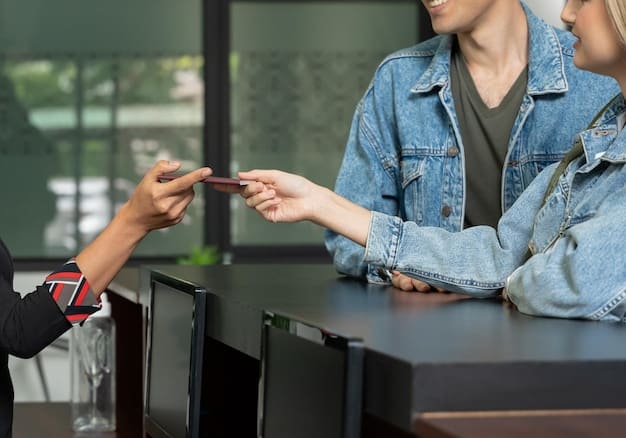 A person using a credit card to pay for a hotel bill at a front desk. The hotel lobby has a luxurious ambiance, with soft lighting and elegant decor. The focus is on the credit card transaction, symbolizing the travel rewards being earned.