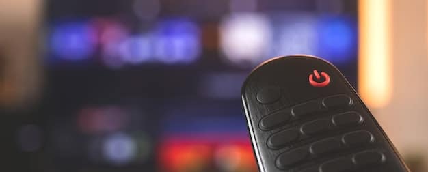 A close-up of a streaming device remote control, highlighting buttons for frequently used streaming services and voice control capabilities. The remote is sleek and modern in design.