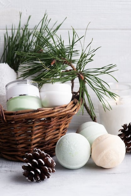A calming display of scented candles and bath bombs arranged on a soft, white towel with some greenery around to enhance the spa-like atmosphere.