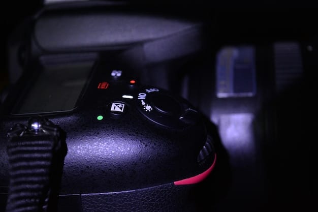 A close-up shot of the new PlayStation 6 console, highlighting its sleek design and advanced cooling system. The background features a blurred image of a gamer immersed in a virtual reality game.