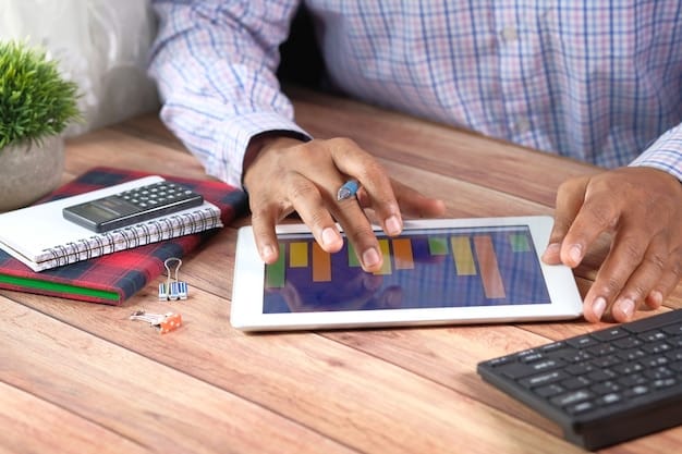 A person holding a credit card, looking thoughtfully at a complex financial spreadsheet with numbers and charts, representing careful financial planning.