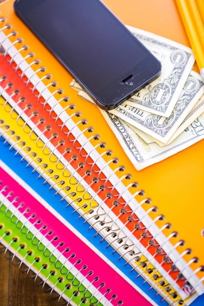 A close-up shot of various credit cards fanned out, with a calculator and a small notebook in the background, symbolizing careful selection and financial planning for rewards.