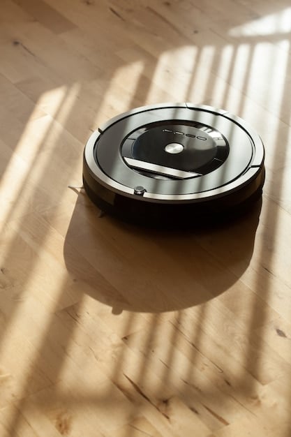 A sleek, modern robot vacuum cleaning a minimalist living room floor, with a graduate's backpack and laptop visible in the background, symbolizing smart living solutions for new graduates.
